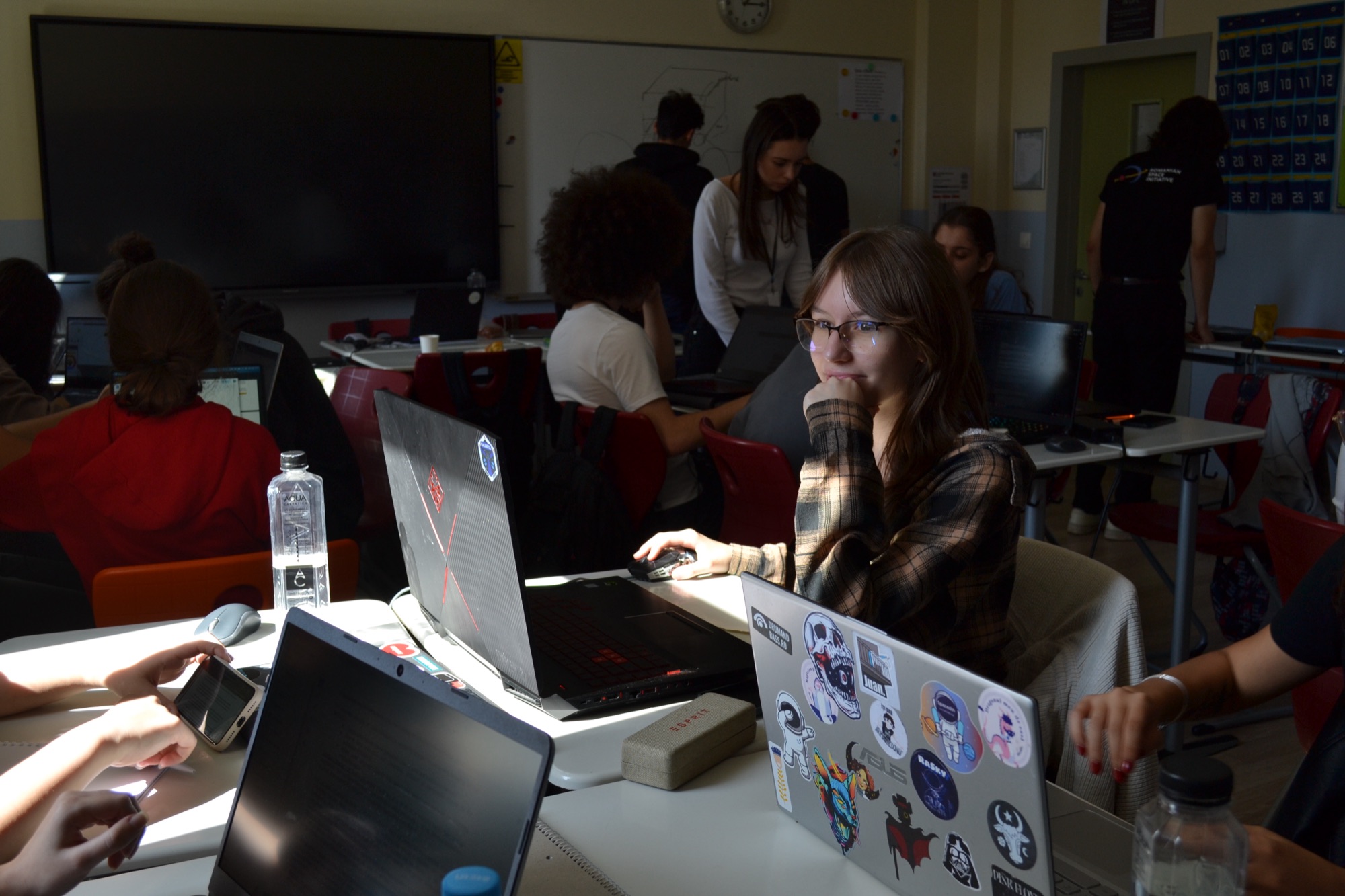 High-school students working on laptops at the ROSDC local stage in Cluj-Napoca